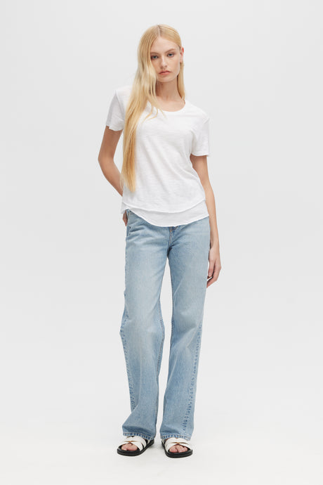 Woman wearing white Ava Mock Layer Tee by CHRLDR, front view