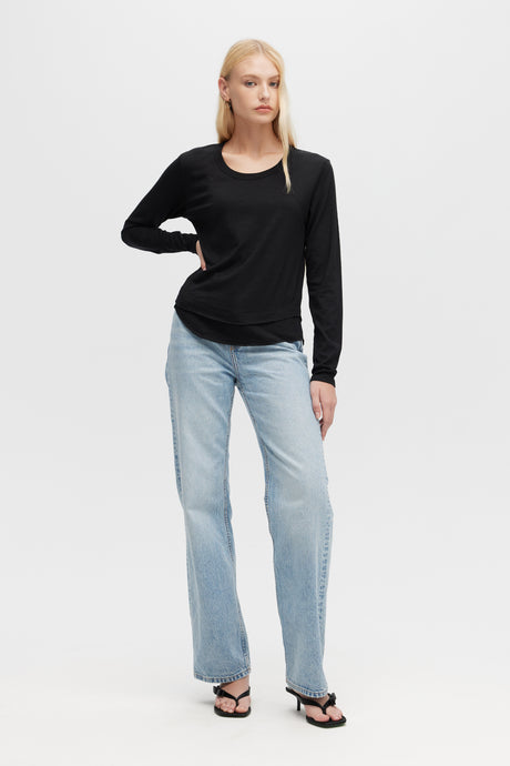 Woman wearing black Ava Mock Layer Long Sleeve tee by CHRLDR, front view