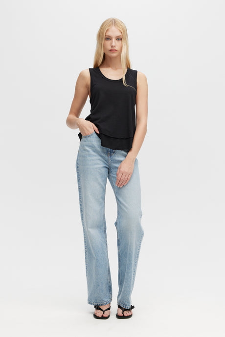 Woman wearing black Ava Mock Layer Tank top by CHRLDR, front view