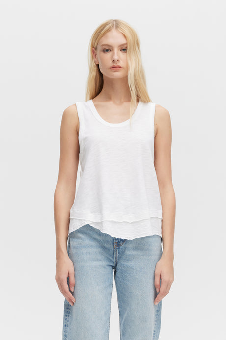 Woman wearing white Ava Mock Layer Tank top by CHRLDR, front view